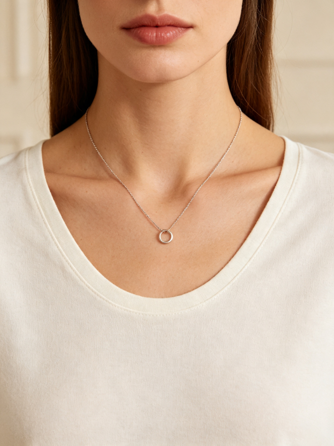 Fine chain necklace with a round pendant